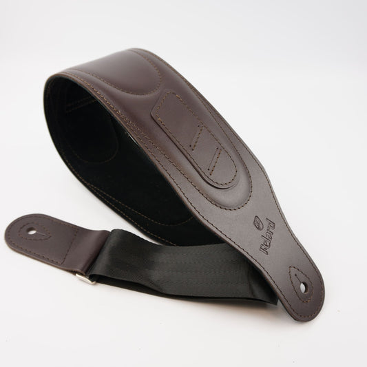 A dark brown leather guitar strap with a black webbing section and silver metal rivets, displayed on a clean white background.