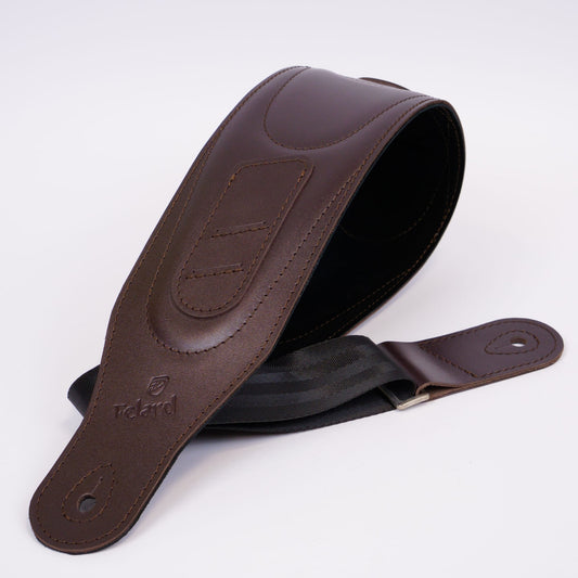 A dark brown leather guitar strap with a black inner lining and a silver metal buckle, shown on a clean white background. The brand name 'Felard' is embossed on the leather.