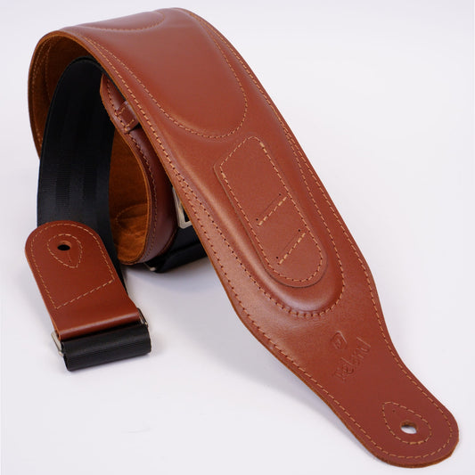 A brown leather guitar strap with black webbing and silver metal hardware, shown on a clean white background.