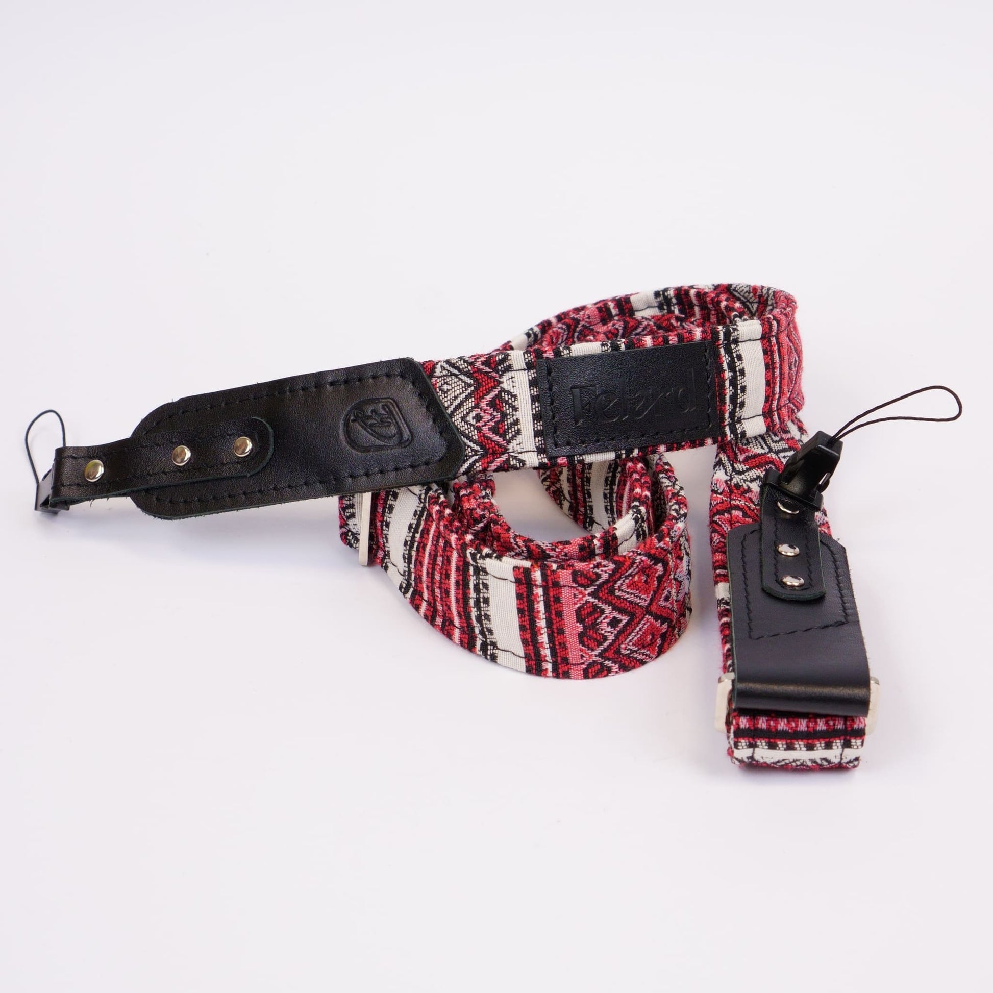 Camera strap with fabric core and leather details slim on white bg