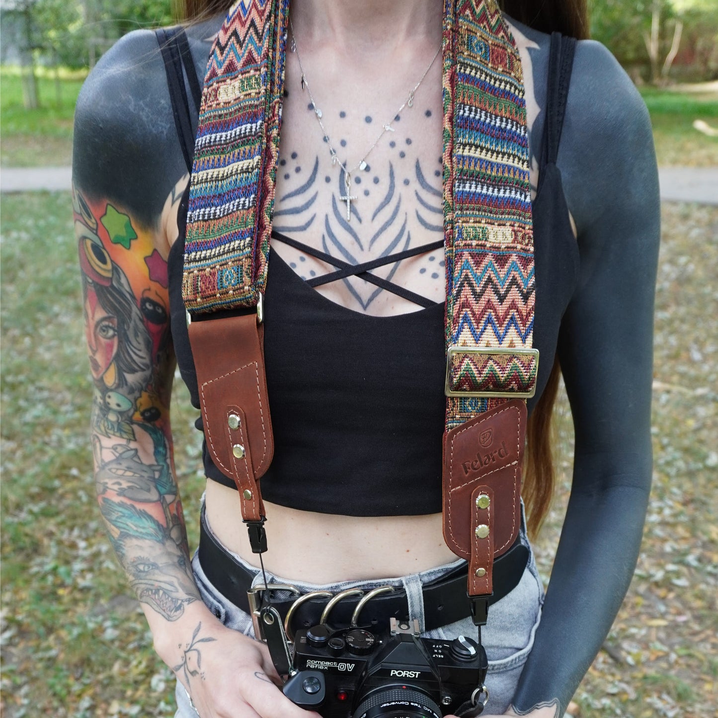 Brown leather and colorful fabric core camera strap lifestyle