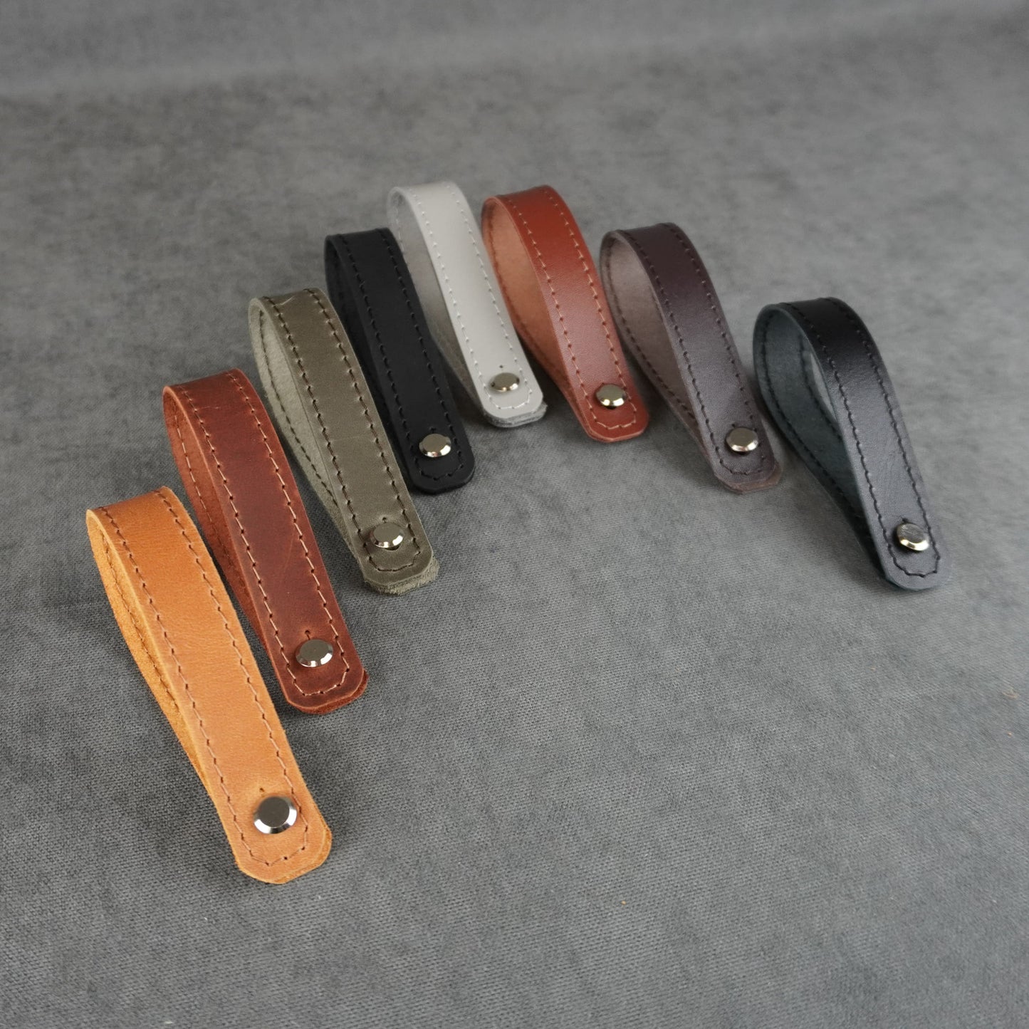 Acoustic guitar strap adapters crafted from genuine leather in various handmade finishes