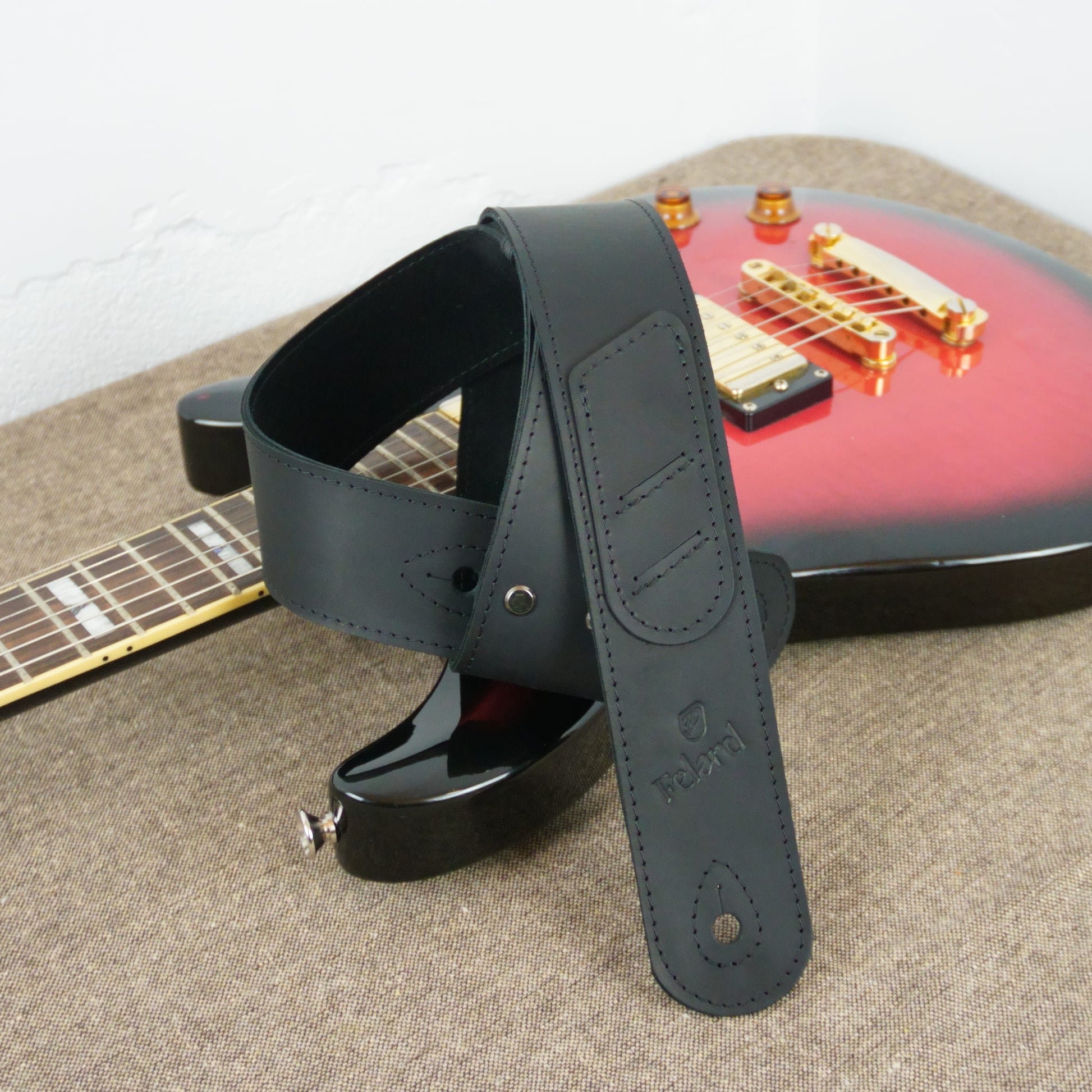 Black leather guitar strap with pick holder