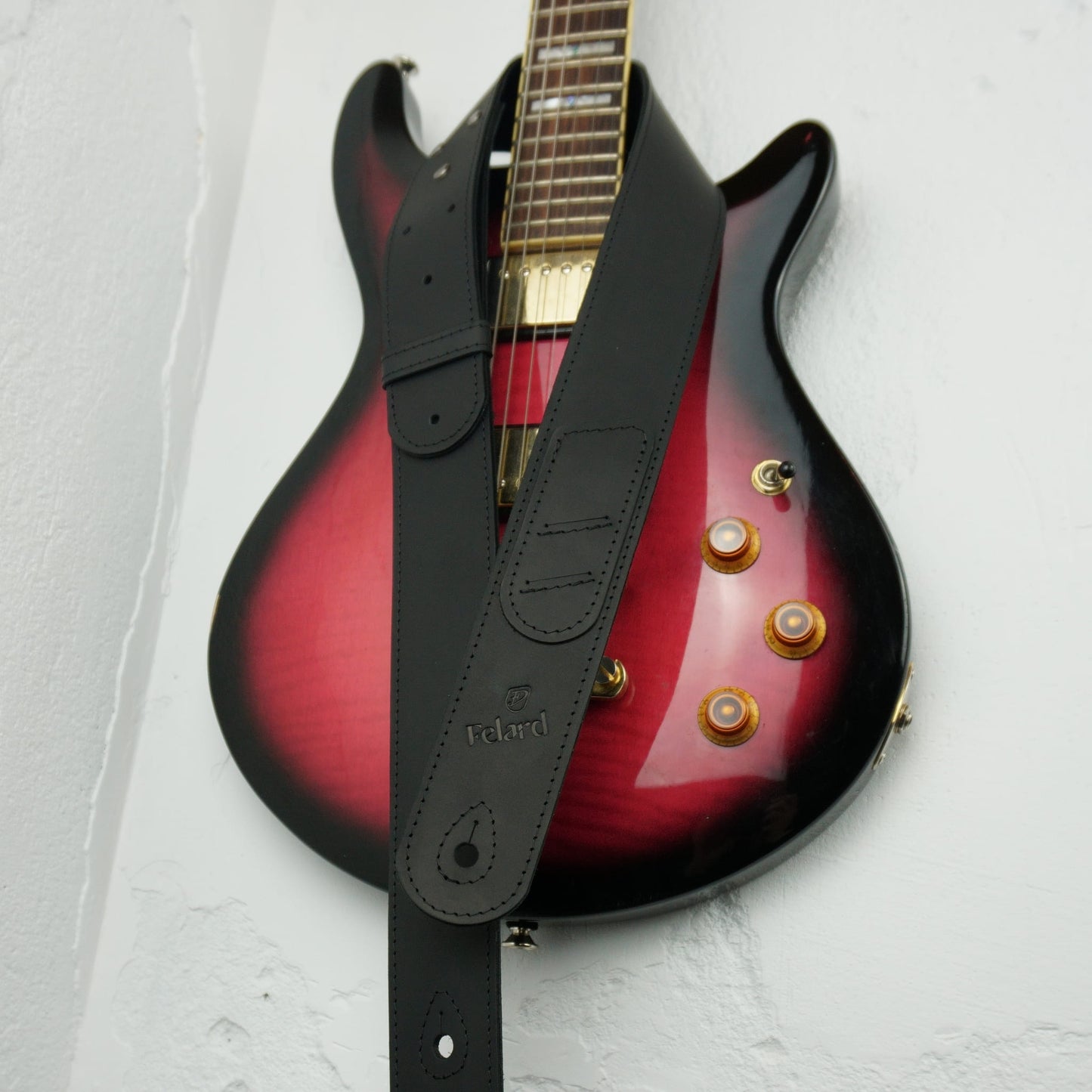 Durable leather guitar strap with metal hardware