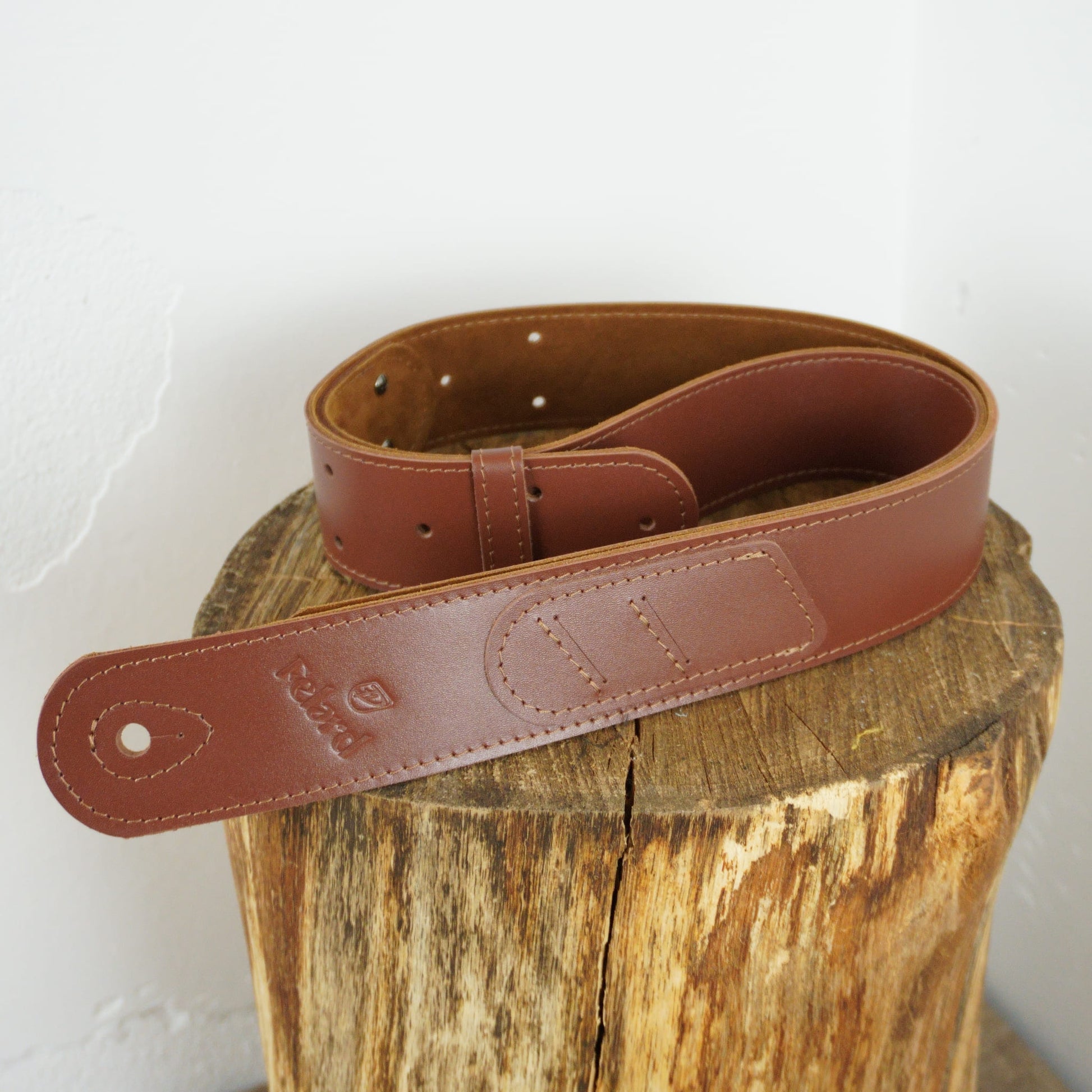 Brown minimalist leather guitar strap for everyday playing