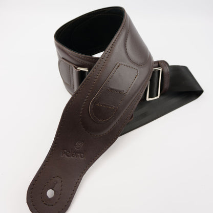 A dark brown leather guitar strap with silver metal buckles, shown coiled on a plain white background. The brand name 'Felard' is embossed on the leather.