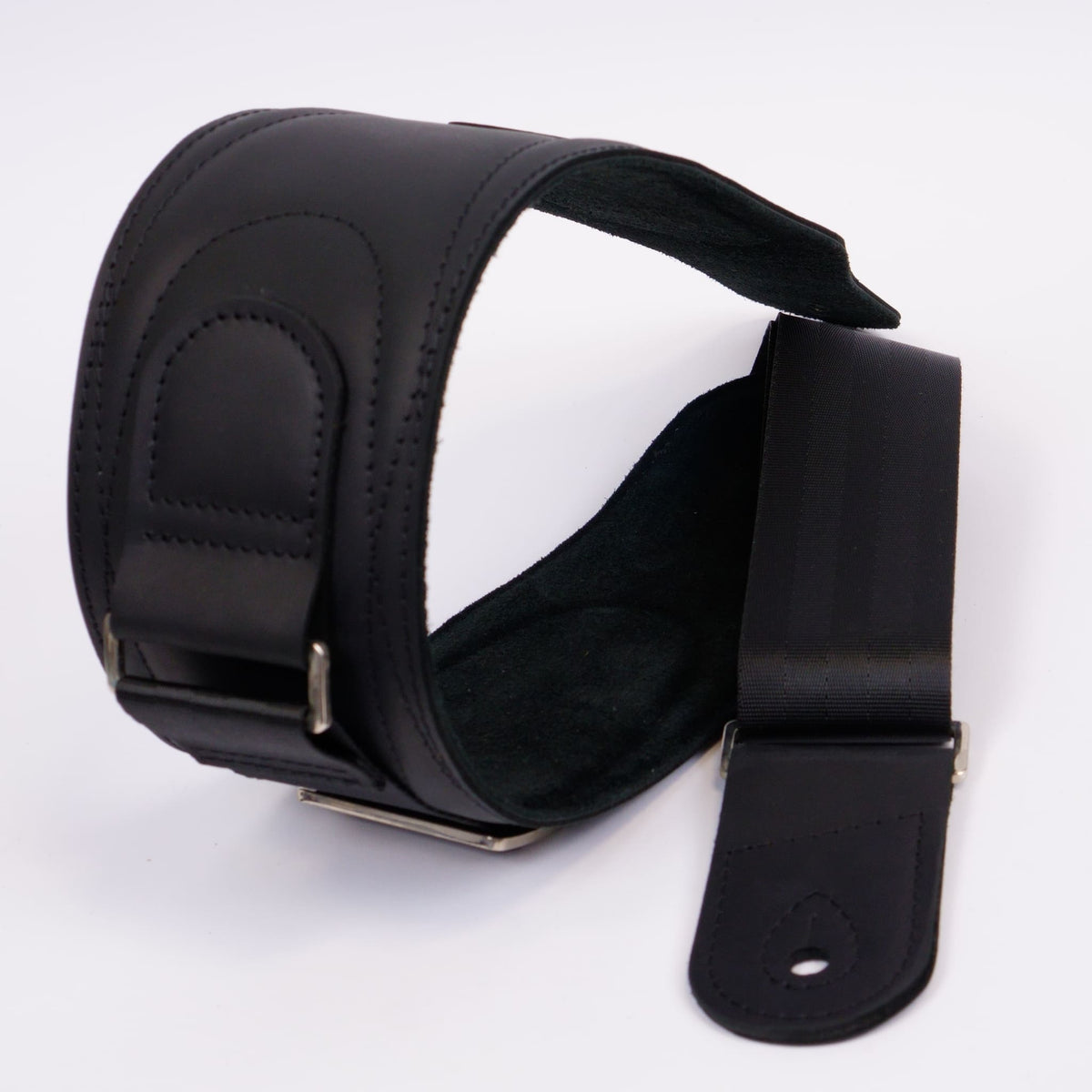 A black leather shoulder guitar strap with adjustable metal buckles, shown on a plain white background.