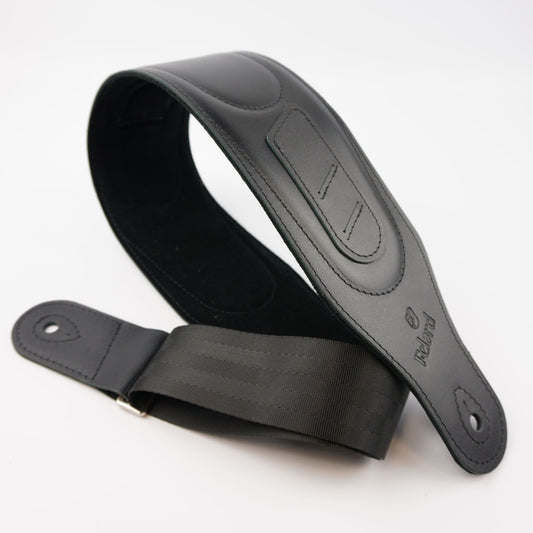 A black guitar strap made of leather and webbing, shown on a clean white background. The brand name 'Felard' is embossed on the leather end.