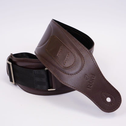 A dark brown leather guitar strap with a black webbing loop and silver buckle, coiled on a white background. The brand name 'Felard' is embossed on the leather.