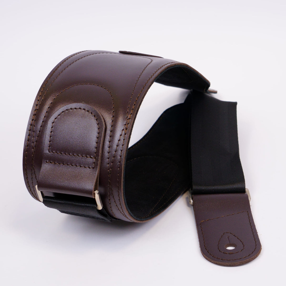 A dark brown leather guitar strap with a padded shoulder section, stitched edges, and a black adjustable webbing section, displayed on a clean white background.