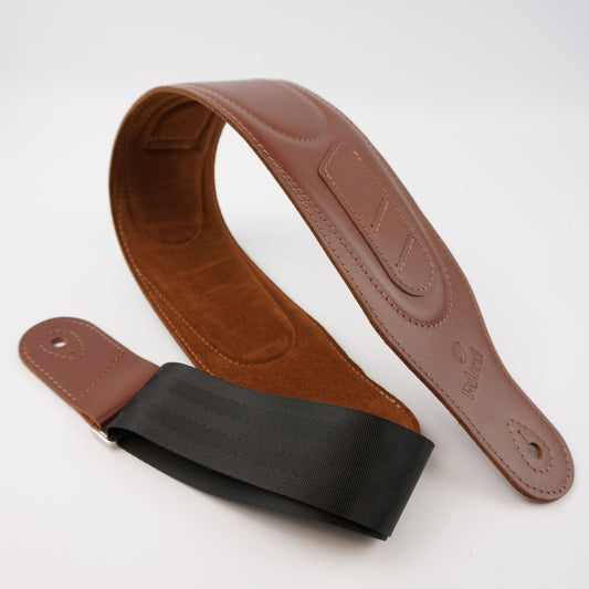 A brown leather guitar strap with a black webbing, displayed on a clean white background.